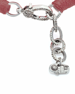 Bracelet with pink threads and diamond, silver charm on a white background