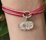Alassio pink and red kumihimo bracelet with a silver diamond caravan charm