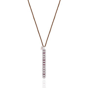 Front view of the Caravan of Stones LOVE Necklace: pavé diamond sterling silver pendant with rubies spelling LOVE in Morse code, on a brown cord