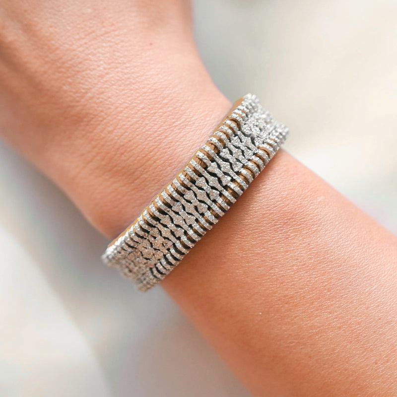 Saddle Camel Stacker bracelet with pavé diamond links worn on the wrist