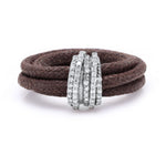 Front view of The Diamond Ring in Cotton by Caravan of Stones: brown braided cotton cord wrapped twice through a curved sterling silver band pavé-set with natural diamonds