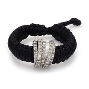 Top view of The Diamond Ring in Black Linhasita: pavé diamond sterling silver band on braided waxed thread with adjustable sliding knot