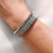 Deep espresso-brown diamond thread bracelet for Winter tones on models wrist.