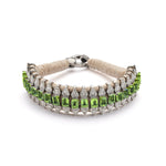 Forte Dei Marmi sand thread bracelet with single-cut diamonds and peridot shown from the front