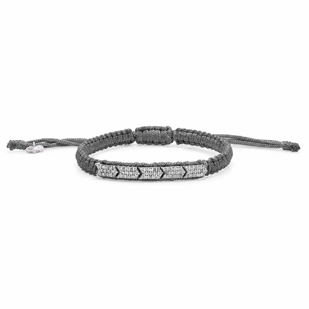 Dark olive gunmetal braided bracelet with pavé diamonds on a white background