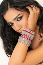 Salar Claret Velvet pavé diamond and emerald bracelet worn on a wrist