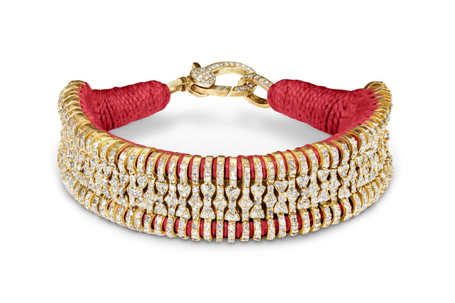 Coral Gold Stacker natural diamond bracelet in coral thread on a white background