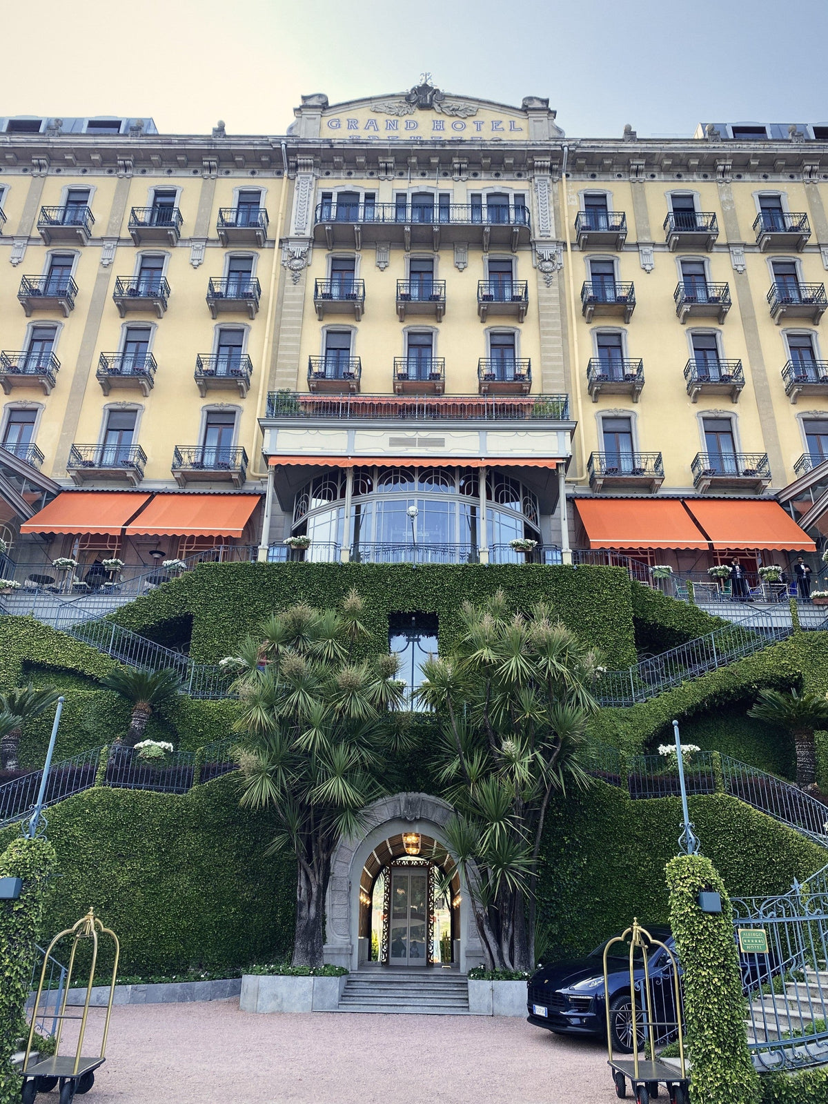 The Art Nouveau facade of Grand Hotel Tremezzo with its signature orange awnings, Lake Como