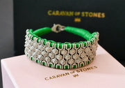 Green thread bracelet with geometric pavé-set natural diamond panels displayed on a Caravan of Stones box
