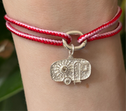Alassio pink and red kumihimo bracelet with a silver diamond caravan charm