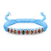 Baby blue Mini Lisse bracelet with multicoloured gemstones and a sliding closure on white
