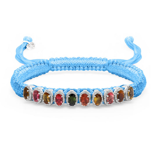 Baby blue Mini Lisse bracelet with multicoloured gemstones and a sliding closure on white