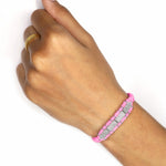Bubblegum pink Row diamond bracelet worn on a wrist against a white background
