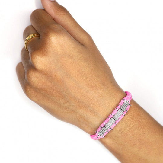 Bubblegum pink Row diamond bracelet worn on a wrist against a white background