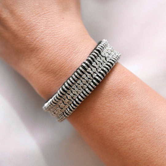 Dark Olive Gunmetal Stacker bracelet with pavé diamond links worn on the wrist