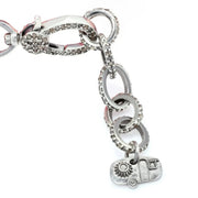 Close-up of diamond-set bracelet links, clasp and Caravan of Stones charm