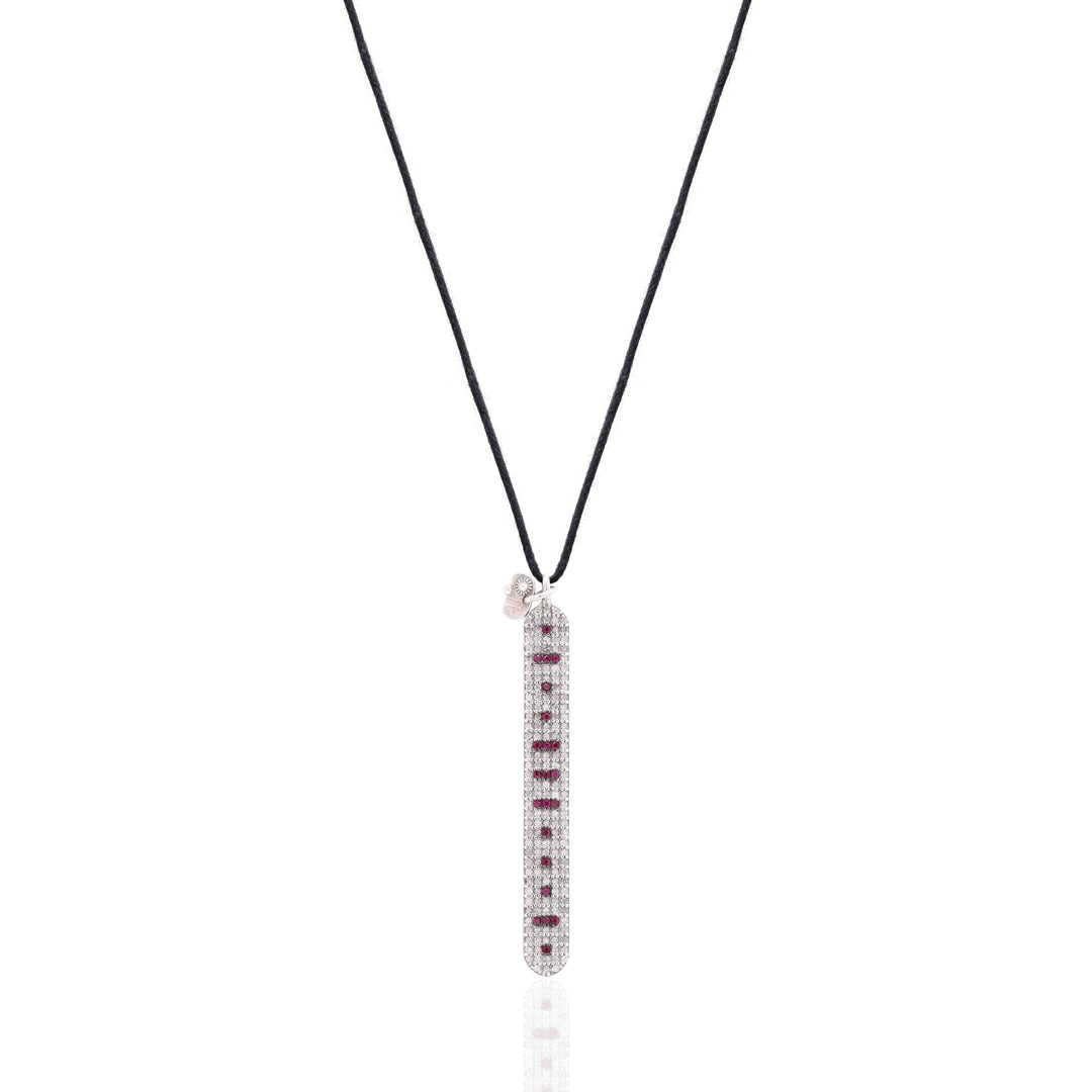 Front view of the Caravan of Stones LOVE Necklace: pavé diamond sterling silver pendant with rubies spelling LOVE in Morse code, on a black cord