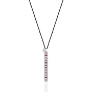 Front view of the Caravan of Stones LOVE Necklace: pavé diamond sterling silver pendant with rubies spelling LOVE in Morse code, on a black cord