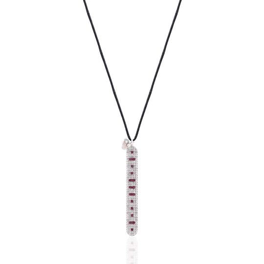Front view of the Caravan of Stones LOVE Necklace: pavé diamond sterling silver pendant with rubies spelling LOVE in Morse code, on a black cord