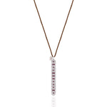 Front view of the Caravan of Stones LOVE Necklace: pavé diamond sterling silver pendant with rubies spelling LOVE in Morse code, on a brown cord