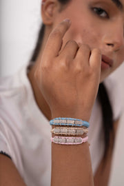 Caravan of Stones Row diamond bracelets in baby blue, baby pink and sand with pavé-set diamonds on colourful thread