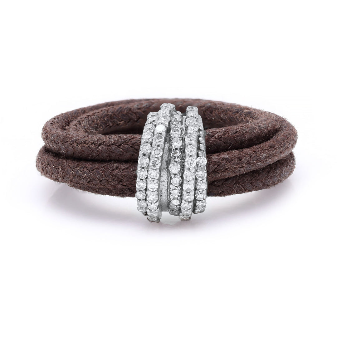 Front view of The Diamond Ring in Cotton by Caravan of Stones: brown braided cotton cord wrapped twice through a curved sterling silver band pavé-set with natural diamonds
