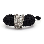 Front view of The Diamond Ring in Linhasita by Caravan of Stones in Black: braided waxed thread through a curved sterling silver band pavé-set with natural diamonds