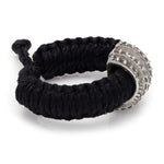 Side view of The Diamond Ring in Black Linhasita, showing the adjustable sliding knot on the braided waxed thread