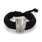 Top view of The Diamond Ring in Black Linhasita: pavé diamond sterling silver band on braided waxed thread with adjustable sliding knot