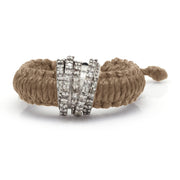 Front view of The Diamond Ring in Linhasita by Caravan of Stones in Saddle Camel: braided waxed thread through a curved sterling silver band pavé-set with natural diamonds
