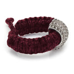 Side view of The Diamond Ring in Vampire Claret Linhasita, showing the adjustable sliding knot on the braided waxed thread