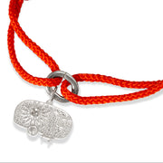 Studio shot of the Como orange kumihimo charm bracelet