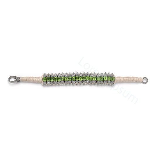 Forte Dei Marmi sand thread bracelet with single-cut diamonds and peridot laid flat