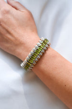 Forte Dei Marmi sand thread bracelet with single-cut diamonds and peridot worn on the wrist