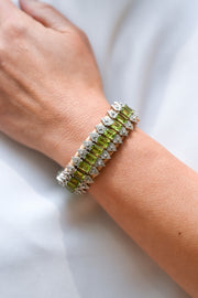 Forte Dei Marmi sand thread bracelet with single-cut diamonds and peridot worn on the wrist