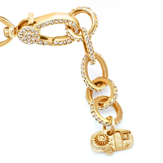 Gold diamond links with signature Caravan of Stones charm