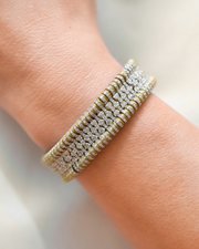Golden Ember Stacker diamond bracelet worn on the wrist with silver details