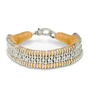 Glowing golden thread bracelet with hand-set diamonds.