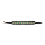 London black thread pavé diamond and emerald bracelet laid flat