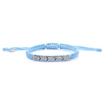 Méridien baby blue bracelet laid flat on a white background