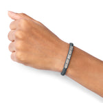Méridien black bracelet worn on a wrist against a white background