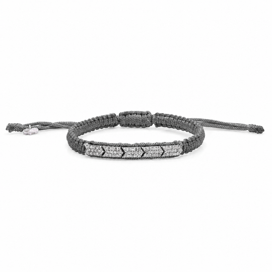Dark olive gunmetal braided bracelet with pavé diamonds on a white background