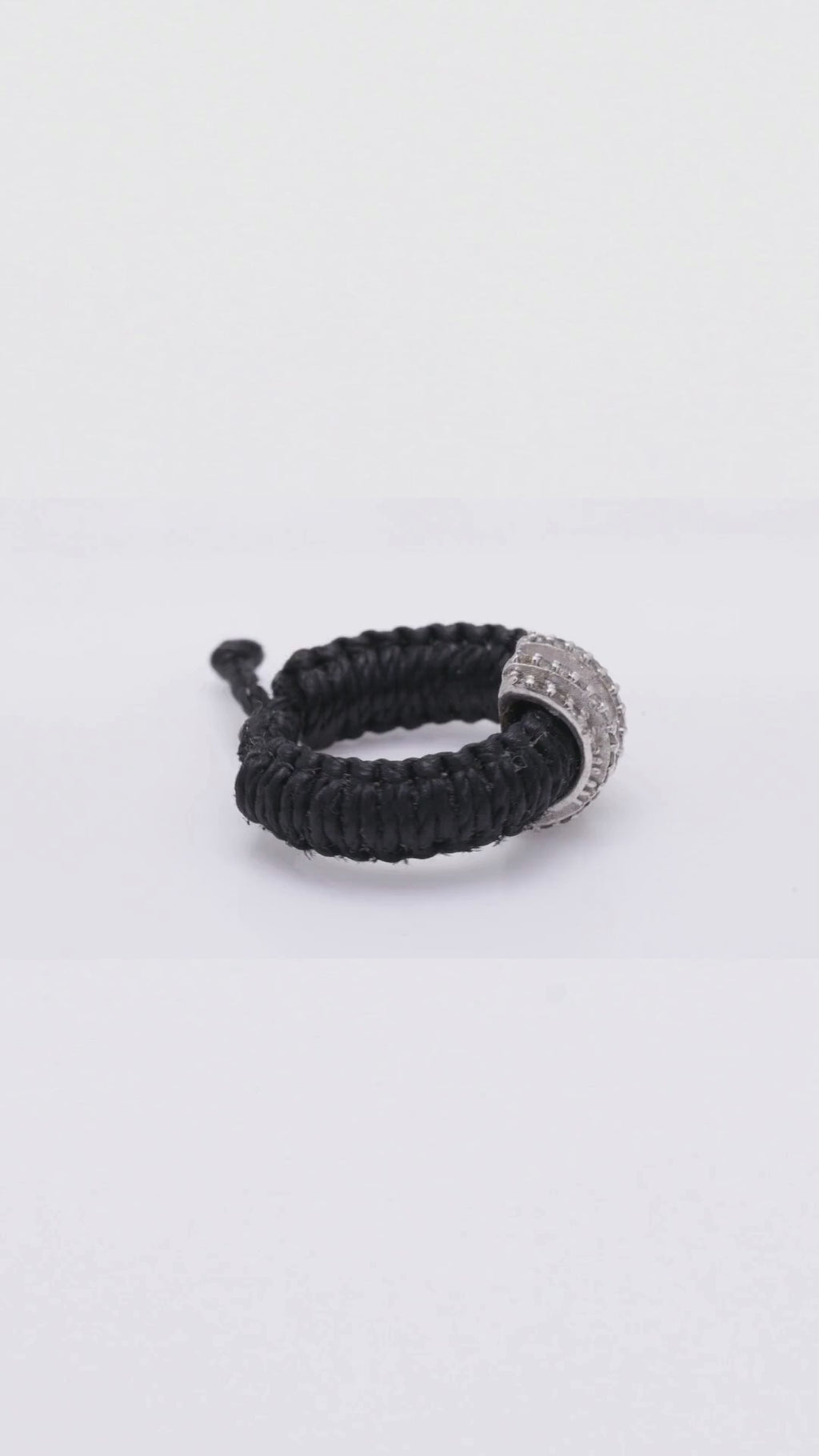 360 spin of the Caravan of Stones Diamond Ring, pavé diamond sterling silver collet on braided Linhasita cord, shown in black, claret and brown