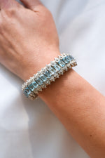 Saint Tropez sand thread bracelet with single-cut diamonds and blue topaz worn on the wrist