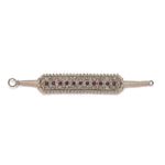 Side view of the Skoura sand thread diamond and ruby bracelet