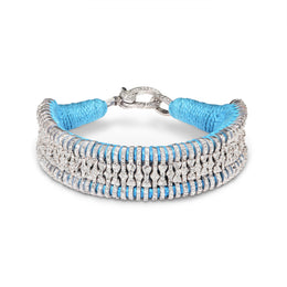 Sky Blue Silver Stacker with blue thread and pavé diamonds on a white background