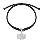 Tokyo black kumihimo bracelet with a silver diamond charm laid flat on white