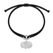 Tokyo black kumihimo bracelet with a silver diamond charm laid flat on white