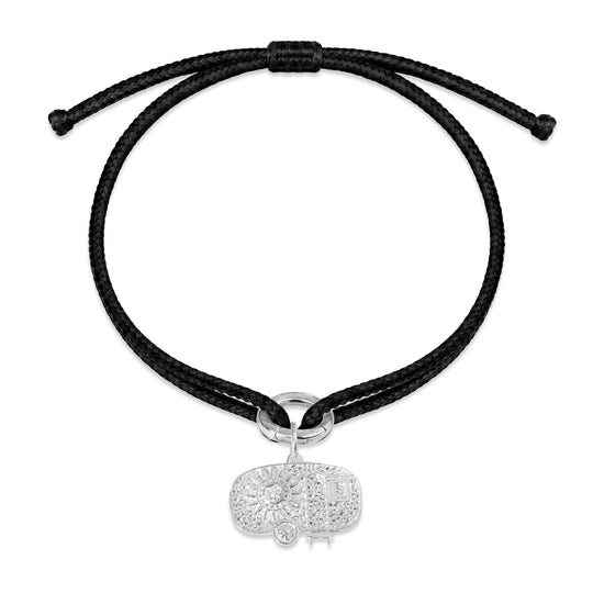Tokyo black kumihimo bracelet with a silver diamond charm laid flat on white