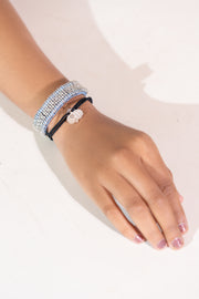 Tokyo two-tone black kumihimo diamond charm bracelet worn on a wrist